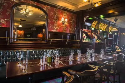 a restaurant with a long table with glasses on it at Ramada by Wyndham Istanbul Florya in Istanbul