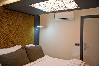 a room with a bed and a ceiling at Yakut Hotel in Istanbul