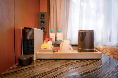 a kitchen counter with a refrigerator and other appliances at Sura Concept Hotel in Istanbul