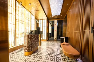 a hallway with a bench in a building with windows at Sura Concept Hotel in Istanbul