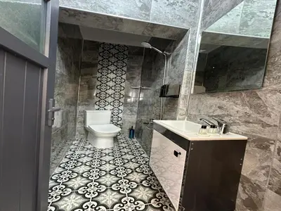 a bathroom with a toilet and a sink at Asıl Kosova Hotel in Istanbul