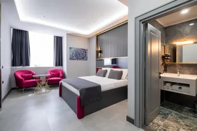 a hotel room with a bed and a bathroom at 216 Prestige Hotel in Istanbul