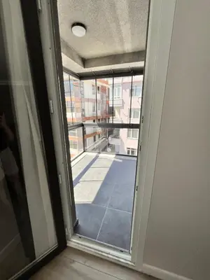 a sliding glass door with a view of a balcony at Sense Suite Residence-KAPALI in Istanbul