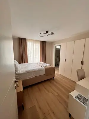 a small bedroom with a bed and a window at Sense Suite Residence-KAPALI in Istanbul