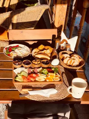a table with a tray of different types of food at The Astra Hotel in Istanbul