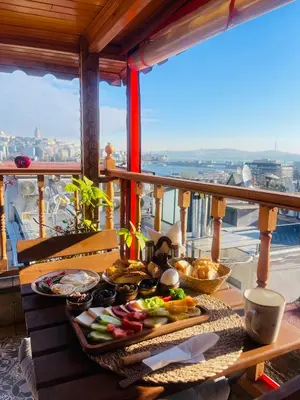 a tray of food on a table on a balcony at The Astra Hotel in Istanbul