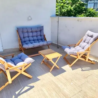 a patio with two chairs and a couch and a table at BOHO HOUSE Istanbul in Istanbul