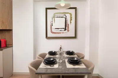 a dining room with a table and chairs at Marmada Suites in Istanbul