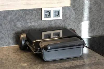 a toaster sitting on a counter next to an electrical outlet at Marmada Suites in Istanbul