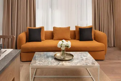 a living room with a couch and a table at Marmada Suites in Istanbul