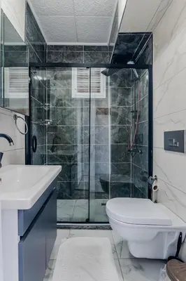 a bathroom with a shower and a toilet and a sink at İstanbul Airport Black Sea Hotel in Arnavutköy