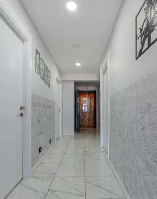 an empty hallway with white walls and a door at İstanbul Airport Black Sea Hotel in Arnavutköy