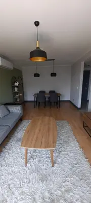 a living room with a couch and a table at NEW Modern Central 2BR 2BA in Istanbul