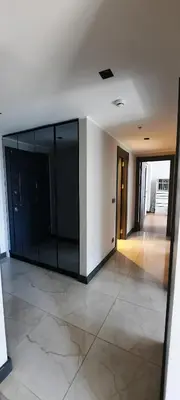 an empty room with a large glass wall at NEW Modern Central 2BR 2BA in Istanbul