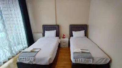 two beds sitting next to each other in a room at Luxury Residence in Taksim in Istanbul