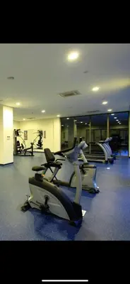 a gym with several cardio bikes in a room at Luxury Residence in Taksim in Istanbul