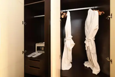 a closet with white clothes and a toaster at Ansen Hotel and Suites in Istanbul