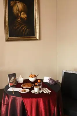 a table with a table cloth with food on it at Ansen Hotel and Suites in Istanbul
