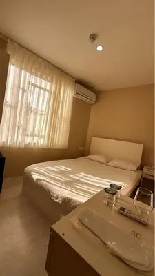 a hotel room with a bed and a window at Rota Star Hotel Beyoğlu in Istanbul