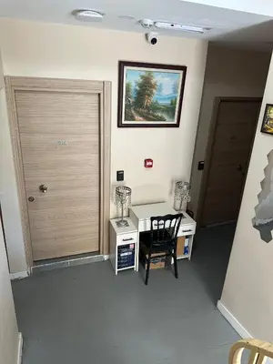 a room with a desk and a table with a chair at Rota Star Hotel Beyoğlu in Istanbul