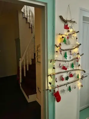 a christmas tree with ornaments on a wall at Konak Maksem in Bursa