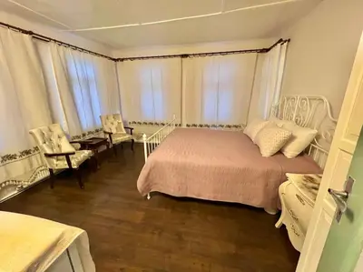 a bedroom with a bed and a table and chairs at Konak Maksem in Bursa