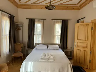 a bedroom with a bed with two towels on it at HanFlats in Istanbul