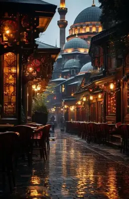 a city street with tables and chairs and a tower at La Pazza Suites in Istanbul