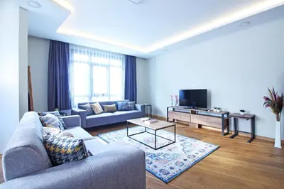 a living room with a couch and a tv at Excellent Apartments Fatih Serenity in Istanbul