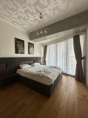 a bedroom with a bed and a coffered ceiling at Sinpaş Queen Bomonti Residence by Bondy in Istanbul