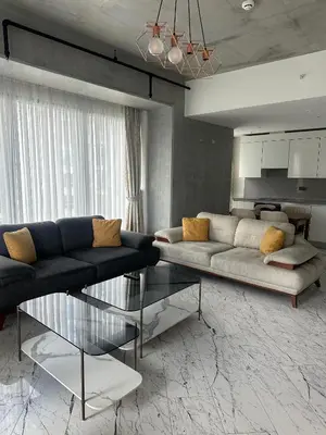 a living room with a couch and a table at Sinpaş Queen Bomonti Residence by Bondy in Istanbul