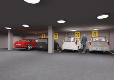 a man standing in a parking garage with cars at Sarissa Hotel in Istanbul