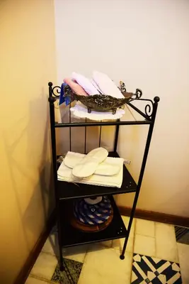 a towel rack with towels on it in a room at Ottoman Suites by Sera House in Istanbul