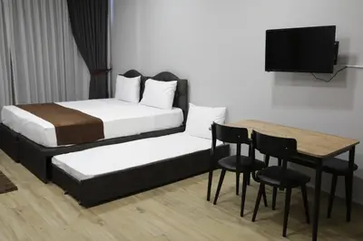 a bedroom with a bed and a table with chairs at Tavra Daltaban in Istanbul