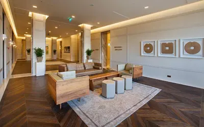 a living room with a couch and a table at Kemer Country Hotel İstanbul in Istanbul