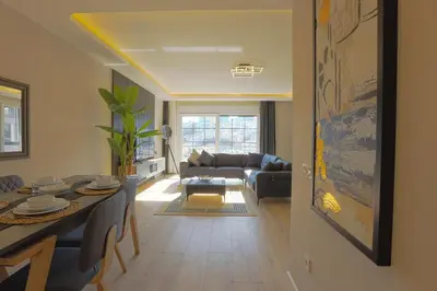 a living room with a table and a couch at Sense Suite Residence-15 in Istanbul
