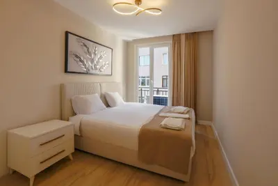 a bedroom with a white bed and a window at Sense Suite Residence-15 in Istanbul