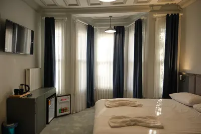 a bedroom with a bed with a robe on it at Lighthouse in Istanbul