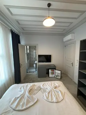 a bedroom with a bed with two white towels on it at Lighthouse in Istanbul