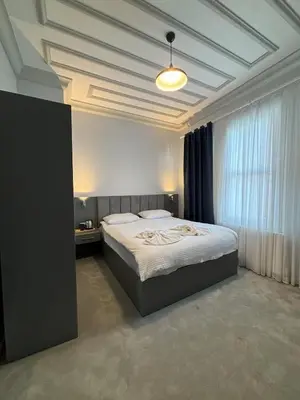 a bedroom with a large bed in a room at Lighthouse in Istanbul