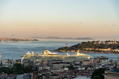 a cruise ship is docked in a large body of water at Ravouna 1906 Bosphorus Istanbul in Istanbul