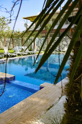 a large swimming pool with lounge chairs at Green Moringa Termal Hotel in Termal