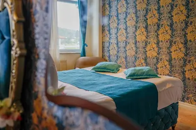 a small bed in a room with a window at Green Moringa Termal Hotel in Termal