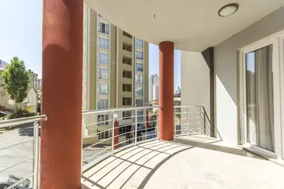a balcony with a view of a building at Nish Suites Atasehir in Istanbul