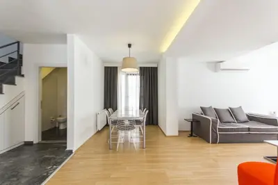 a living room with a couch and a table at Nish Suites Atasehir in Istanbul