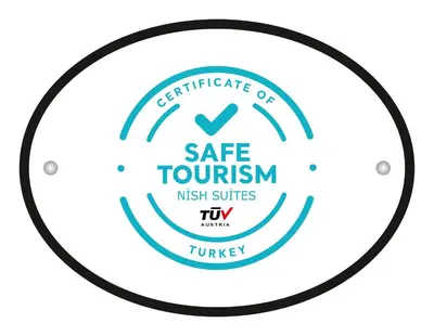 a circle certificate of safe tourism night services tiwi logo at Nish Suites Atasehir in Istanbul