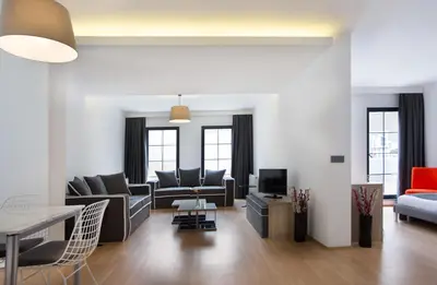a living room with couches and a tv at Nish Suites Atasehir in Istanbul
