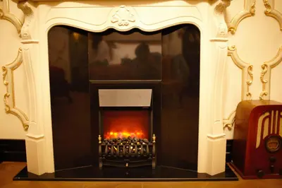 a fireplace with a fire inside of it at Nordstern Hotel Galata in Istanbul