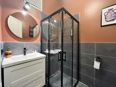 a bathroom with a shower and a sink and a mirror at Charming 2BR AC in Center - Santur D1 in Istanbul