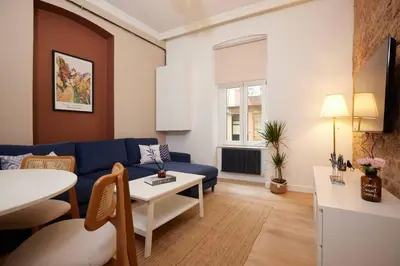 a living room with a blue couch and a table at Charming 3BR 2Bath AC in Center - Santur D2 in Istanbul